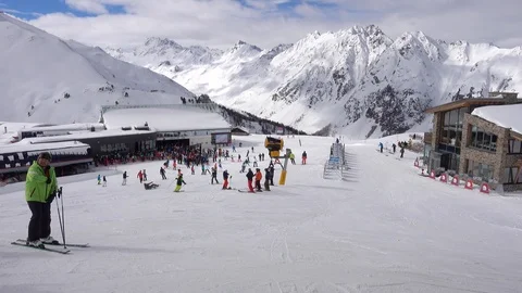 Skiers going to  the crowded cabel car snowy Mountain view Ski Resort Austria Stock Footage 104230959