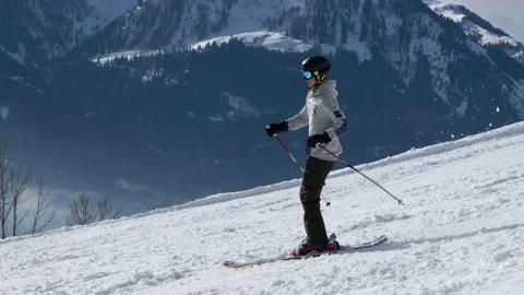 Skiers going down a mountain in slow motion Stock Footage 231550769