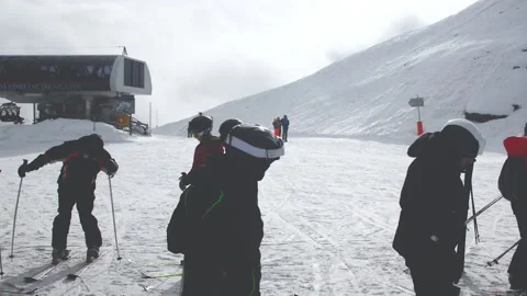 Skiers going to ski during cloudy winter day in Nassfeld. Stock Footage 152688530