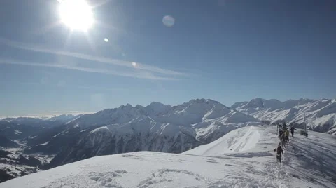 Skiers hike up the summit Stock Footage 46147849