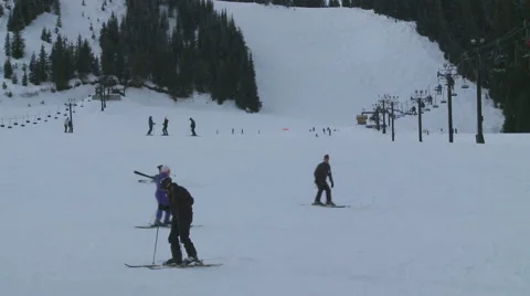 Skiers Hitting the Slopes on a Cloudy Day in Washington State Stock Footage 54713751