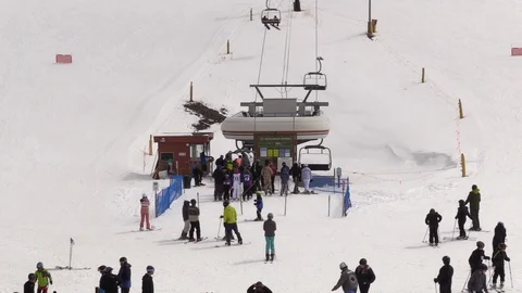 Skiers Loading onto Ski Lift in Colorado Stock Footage