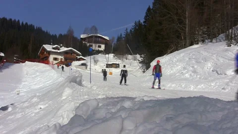 Skiers passing by Stock Footage 145075948
