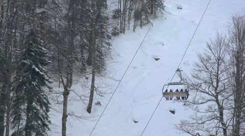 Skiers ride on the ski lift with big baskets Stock Footage