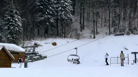 Skiers ride on the ski lift with big baskets Stock Footage