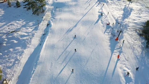 Skiers on ski track Stock Footage 263586835