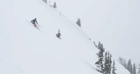 Skiers skiing down the snowy mountain slope Stock Footage 86247533