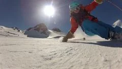 Skiers skiing over camera Stock Footage