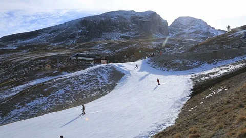 Skiers on a Slope with Artificial Snow Stock Footage 104286227