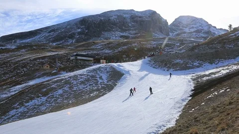 Skiers on a Slope with Artificial Snow Stock Footage 109645461