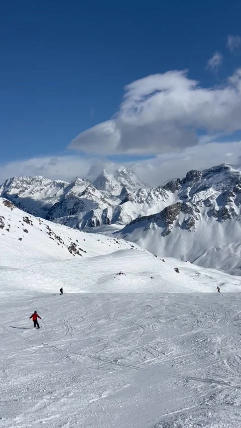 Skiers on the slopes of Courchevel Stock Footage 336928673