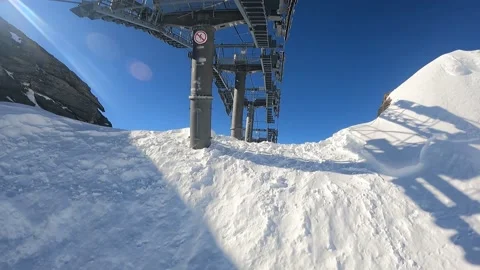 Skiers take the cable car to the top of the mountain Stock Footage 183903096