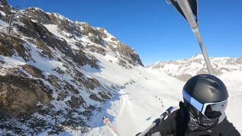 Skiers take the cable car to the top of the mountain Stock Footage 183910454