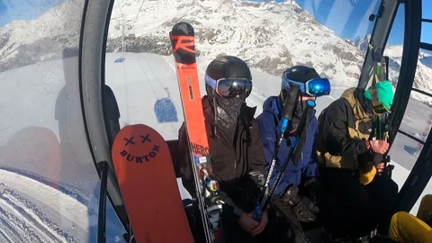 Skiers take the cable car to the top of the mountain Stock Footage 183915400
