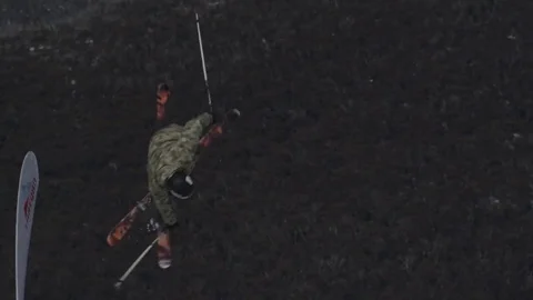 Skiier in camouflage performs another jump. Stock Footage 81882415
