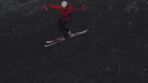Skiier in red performing another jump. Stock Footage 81882395
