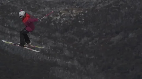 Skiier in red performing jump. Stock Footage 81882393