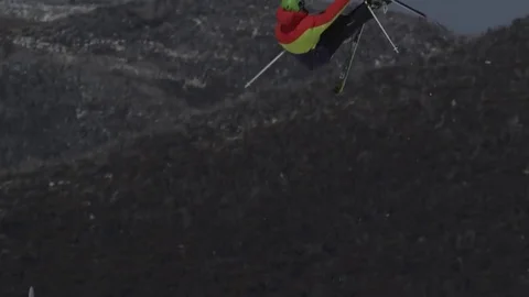 Skiier in red/yellow/black. Stock Footage 81882378