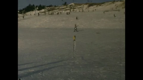 Skiiing downhill in a resort Stock Footage 251908783