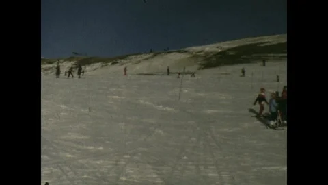 Skiiing together in a resort Stock Footage 251909044