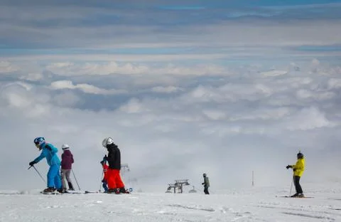 Skiing above the clouds Stock Photos