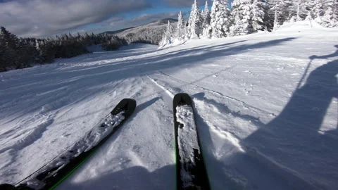 Skiing. Action camera low angle view of skis of skier going downhill on alpine Stock Footage 161367288