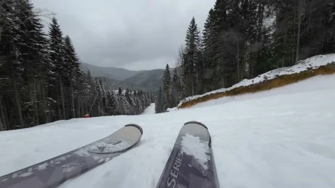 Skiing. Action camera low angle view of skis of skier going downhill Stock Footage 178967389