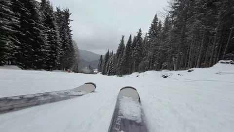 Skiing. Action camera low angle view of skis of skier going downhill on ski Stock Footage 202677435