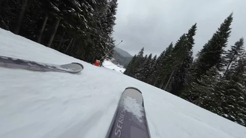 Skiing. Action camera low angle view of skis of skier going downhill Stock Footage 229485629
