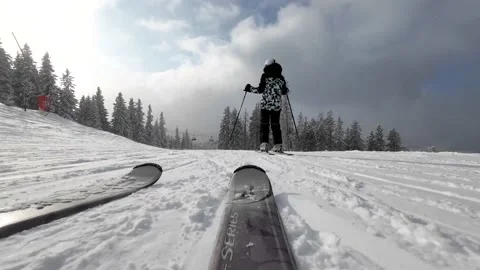 Skiing. Action camera low angle view of skis of skier going downhill on ski Stock Footage 237909068