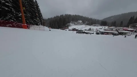 Skiing. Action camera low angle view of skis of skier going downhill on ski Stock Footage 260343250