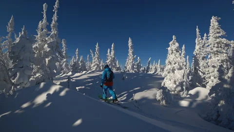 Skiing in a bright suit Stock Footage 139936460