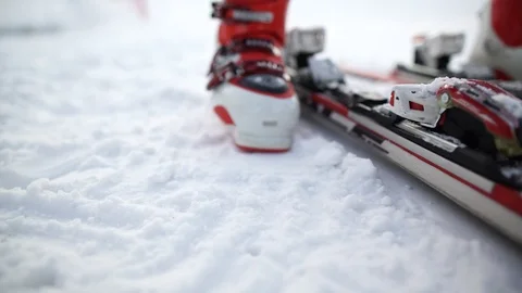 Skiing. A close-up of a ski boot and equipment. Fixing the boot in the skiing. Stock Footage 94888835