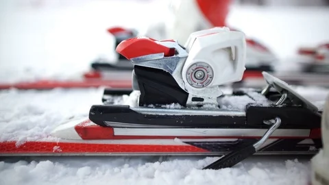 Skiing. A close-up of a ski boot and equipment. Fixing the boot in the skiing. Stock Footage 94889075