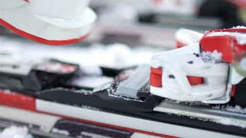 Skiing. A close-up of a ski boot and equipment. Fixing the boot in the skiing. Stock Footage 94889278