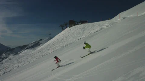 Skiing couple on empty piste Stock Footage 39616468