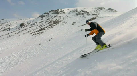 Skiing on dangerous slope Stock Footage 796994
