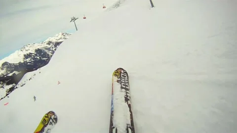 Skiing down mountain action ground level 스톡 동영상 169190280