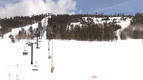 Skiing down Mountain next to Ski Lift in Colorado Stock Footage 93376861