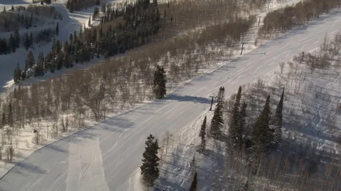 Skiing down snowy mountain Stock Footage 75214299