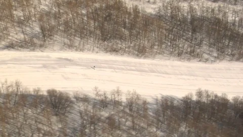 Skiing down snowy mountain Stock Footage 75214309