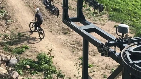Skiing elevator lifting downhill bikers up. Video stock 94742663