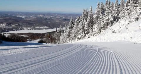 Skiing First Tracks. Closeup of perfect groomed alpine skiing piste trail slope 스톡 동영상 161361580