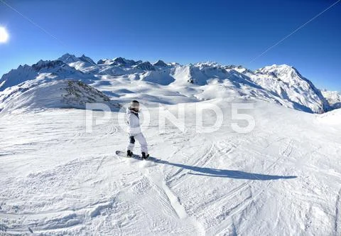 Skiing on fresh snow at winter season at beautiful sunny day Stock Photos