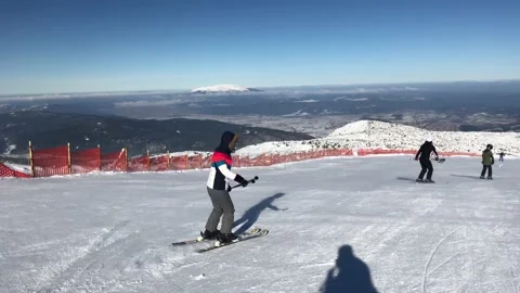 Skiing in mountains in Bulgaria Stock Footage 131381512