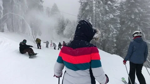 Skiing in mountains in Bulgaria Stock Footage 131382995