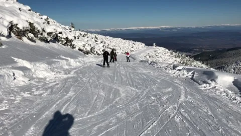Skiing in mountains in Bulgaria Stock Footage 131383362