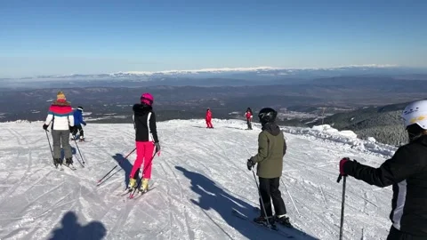 Skiing in mountains in Bulgaria Stock Footage 131383402