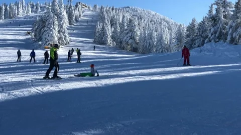 Skiing in mountains in Bulgaria Stock Footage 131383463