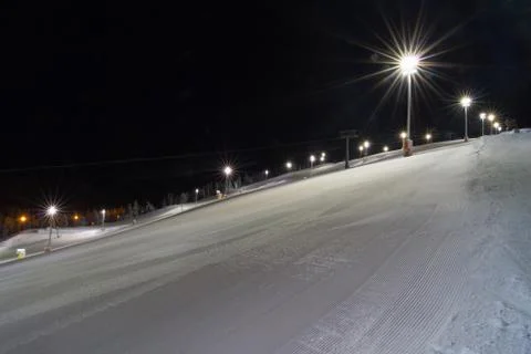 Skiing at night Stock Photos